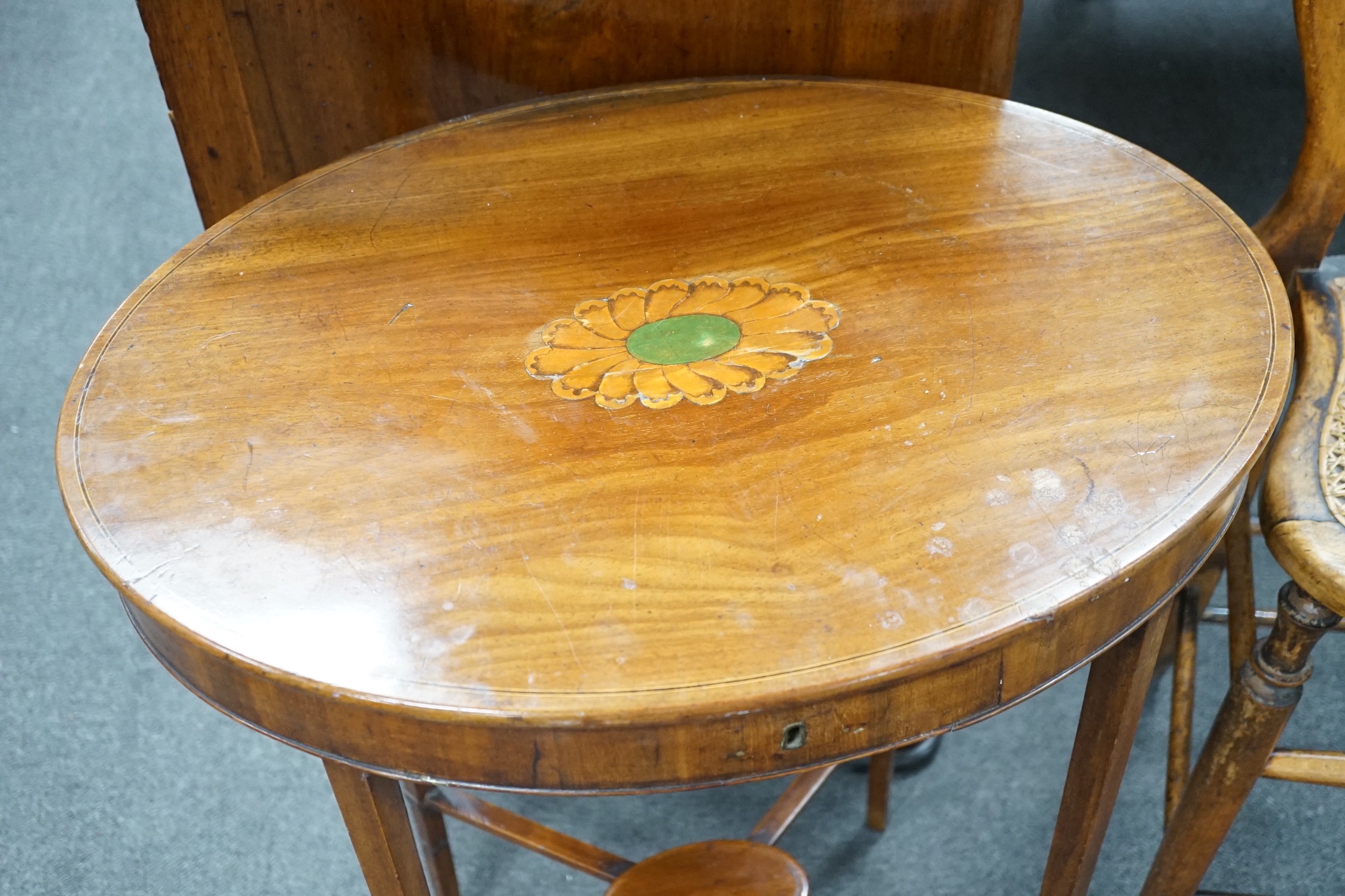 A Victorian caned beech child's correction chair and an Edwardian inlaid mahogany oval occasional table